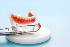 Learn essential tips for caring for your dentures from Distinctive Dental Concepts in Garland, TX. Keep your dentures clean, comfortable, and long-lasting with proper daily maintenance._FI